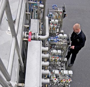 Engineer looking at new natural gas odorization system 